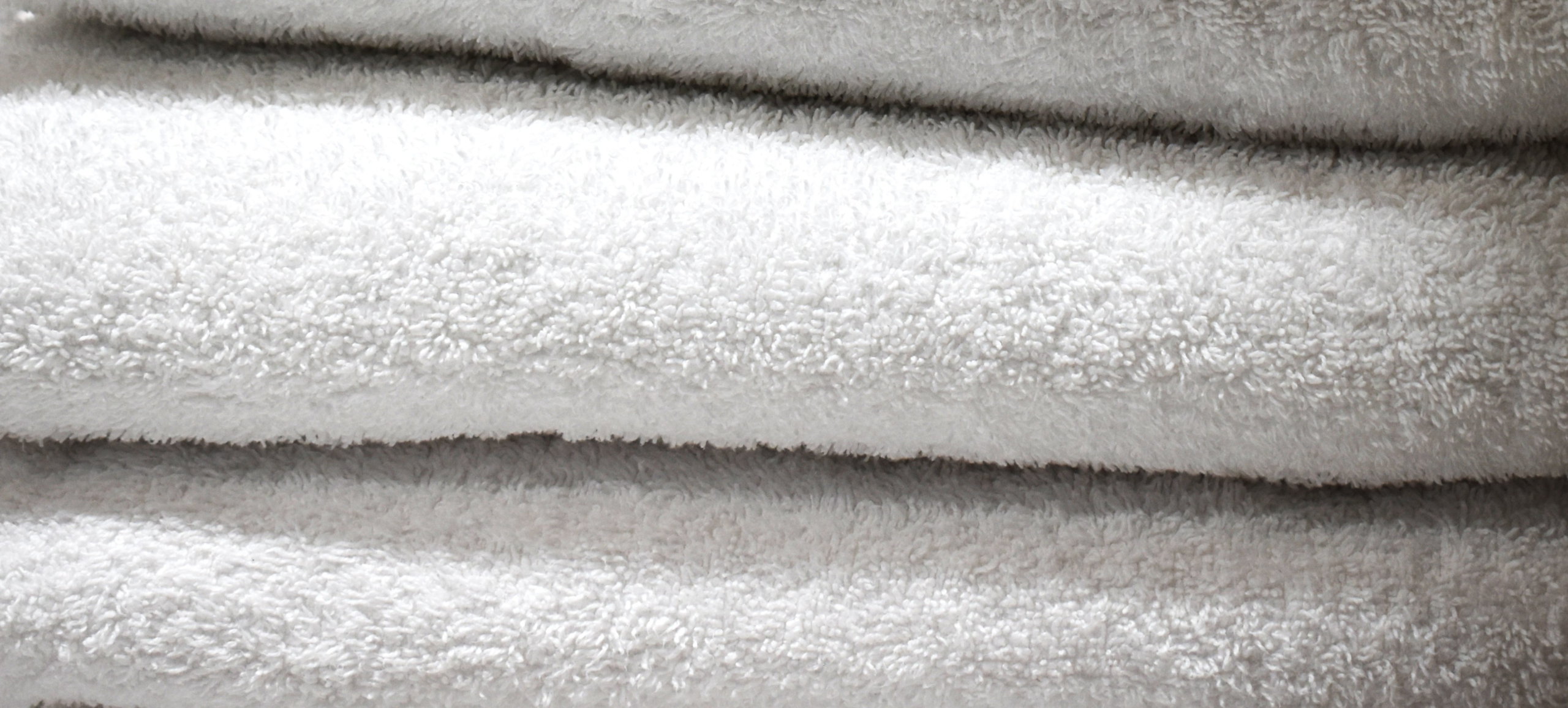 The Hidden Costs of In-House Laundry in Hospitality